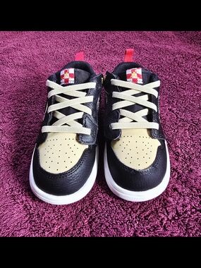 Nike Jordan Kids Black and Cream Low-Top Sneakers with Red Pull Tabs